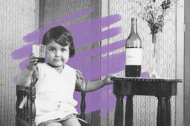 French child with glass of wine