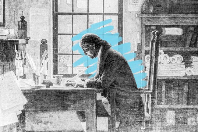 Benjamin Franklin writing at desk