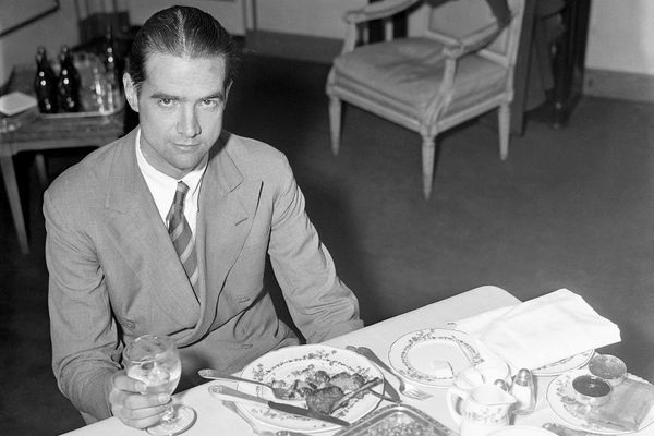Howard Hughes eating breakfast, c. 1938