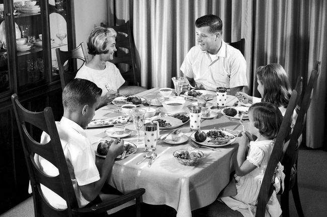 Family eating dinner, circa 1950s