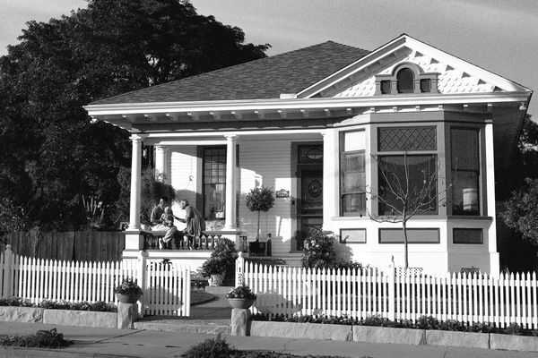 Family sitting on a front porch