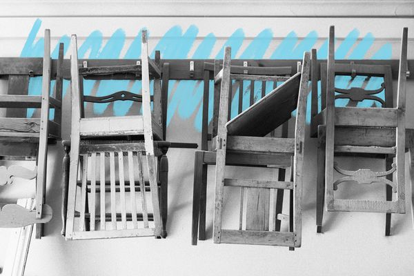 Chairs for restoration hanging on a wall